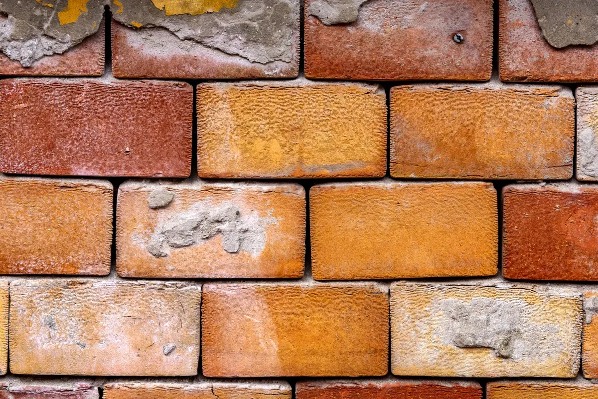 Close-up of a brick and mortar masonry wall